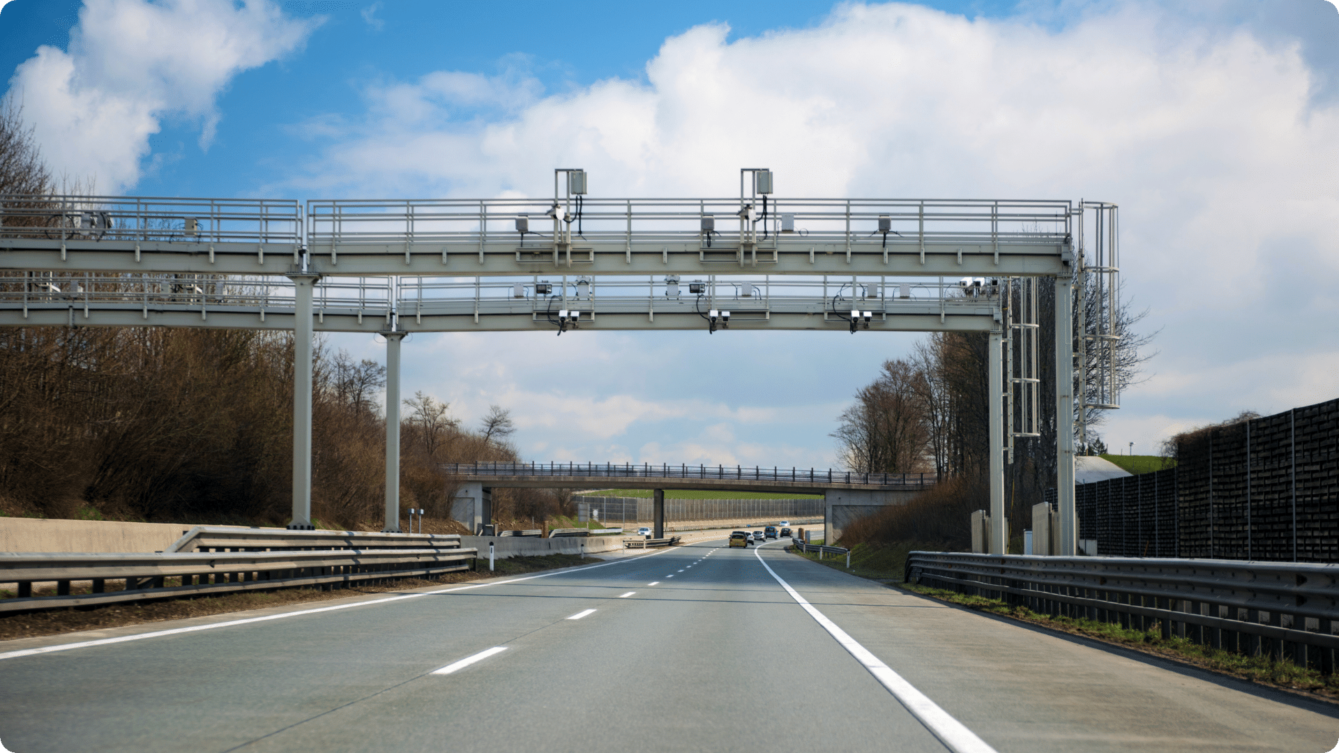 Road with an automatic traffic toll